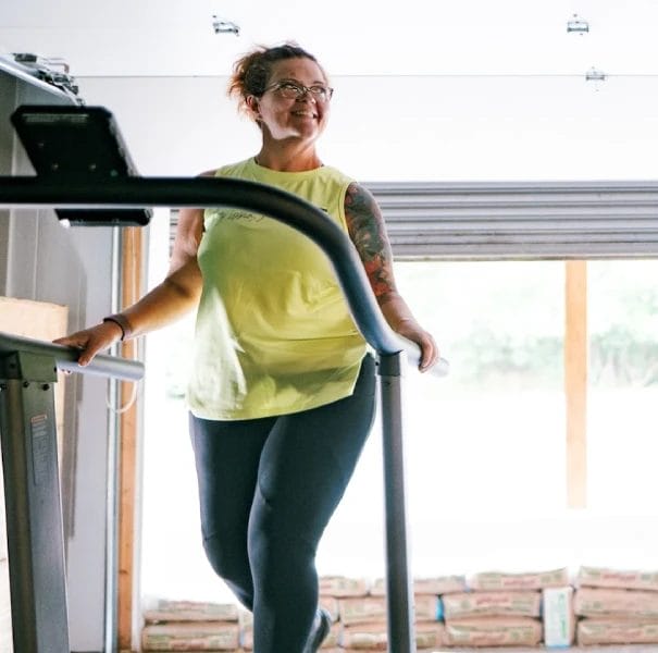 Two women walking on treadmills during cardio session at CrossFit Plainfield